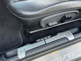 a close up of a car door handle with a remote control