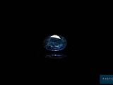 a close up of a blue diamond on a black background