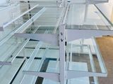 a lot of glass shelves that are on the floor