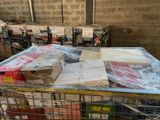 a cart full of boxes and boxes wrapped in plastic