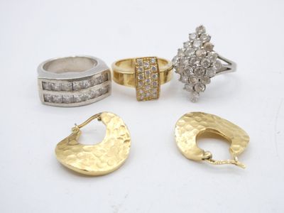 three pairs of gold and silver rings and a ring with diamonds