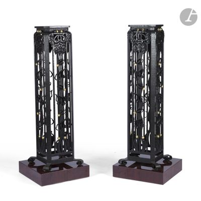 pair of black metal and wood clock stands on a white background