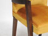 an image of a yellow chair with a wooden frame and arm rest