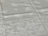 a white table cloth with a pattern on it
