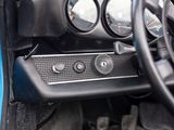 a close up of a steering wheel and dashboard of a car