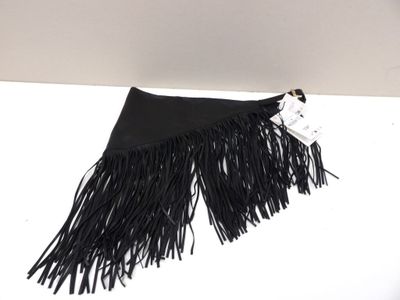 a close up of a black fringe bag on a white surface
