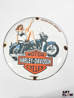 a plate with a picture of a woman on a motorcycle on it