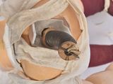 a doll with bandages wrapped around it ' s head