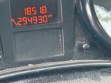 a digital clock on the dashboard of a car