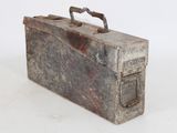 an old metal box with a handle on a white surface