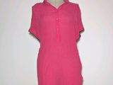 a picture of a pink dress on a mannequin stand