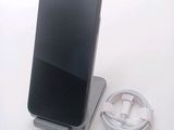 a cell phone that is sitting on top of a charger