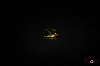 a small window in the middle of a dark room