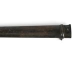 a knife that is laying on a white surface