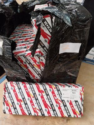 a pile of black plastic bags sitting on top of a table