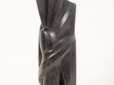 an image of a sculpture of a woman with a fan on her head