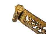 a close up of a gold object on a white background