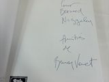 a book with writing on it sitting on a table