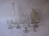 a lot of glass items that are sitting on a table