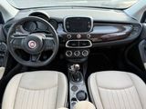 the interior of a car with a steering wheel, dashboard and dashboard controls