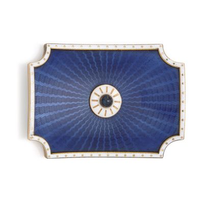 a blue tray with a clock on it on a white surface