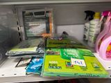 a refrigerator with a lot of cleaning supplies on it