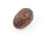 a close up of a wooden object on a white surface