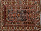 un tapis persan ancien à motifs géométriques sur fond bleu
