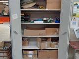 a large open storage cabinet in the middle of a room