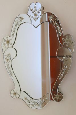a mirror that is hanging on the wall in the room