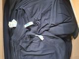 a box full of clothing that is sitting on the floor