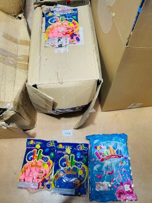 a box of candy and a bag of candy sitting on the floor