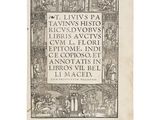 an old book with a black and white image of people in a medieval setting