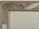 a picture of a mirror hanging on the wall