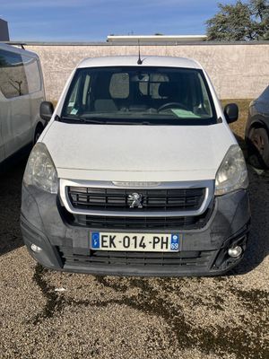 a white van parked in a parking lot next to a white van