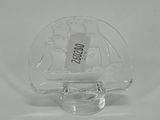 a small clear glass bottle with a label on it