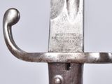 a close up of a sword with a metal handle