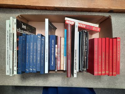 many books that are on a shelf in a book case