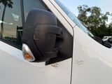 an image of a side view mirror on a white van