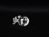 a close up of a silver ring on a black surface