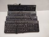 a lot of keyboards that are sitting on a table
