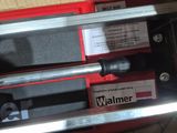 two tools in a box that are sitting on a table