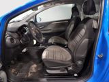 the interior of a small blue car with black leather seats