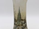 a glass vase with a picture of a church on it