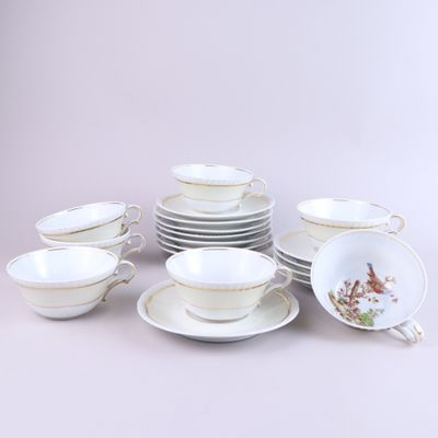 a lot of plates and cups on the table