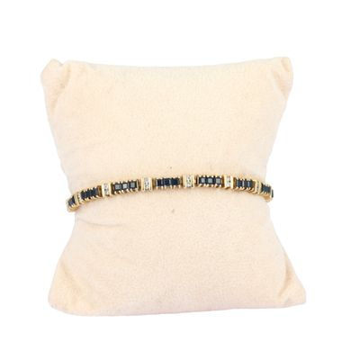 Bracelet ligne articulé en or jaune 585‰ composé de suites d…