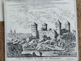 an old drawing of a castle on a wooden table