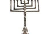 an image of a silver menorah with five candles on it