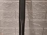 a baseball bat sitting on the ground next to a wall