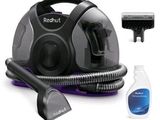 a vacuum that is sitting next to a bottle of cleaner